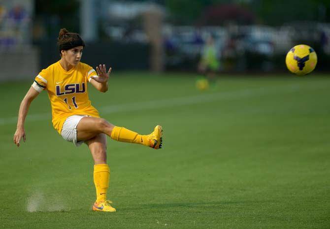 LSU senior midfielder Natalia Gomez-Junco (11) kicks the ball towards her teammates stationed near the goal on Tuesday, Aug. 25, 2015, during the Tigers' 1-1 tie against Northwestern State at LSU Soccer Stadium.