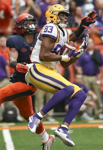 LSU wide receiver Travin Dural (83) makes a catch in front of Syracuse cornerback Julian Whigham (1) during the second half of an NCAA college football game on Saturday, Sept. 26, 2015, in Syracuse, N.Y. (AP Photo/Mike Groll)