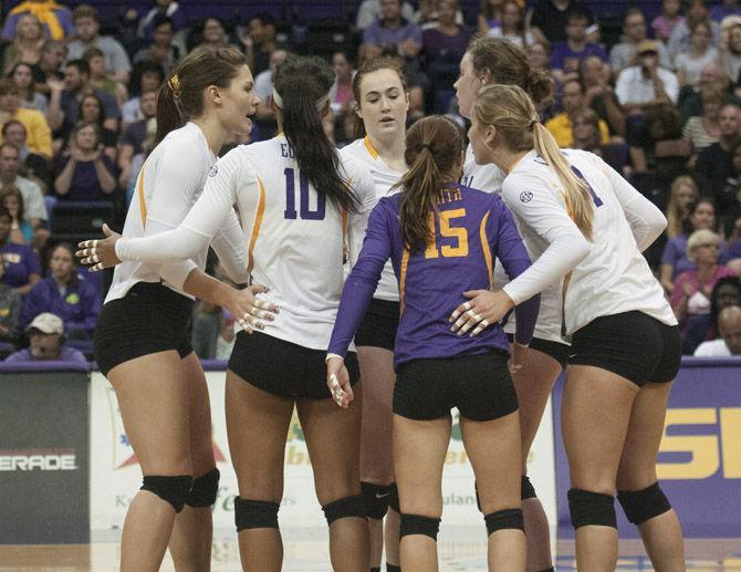 The LSU Volleyball team huddles between plays on Friday, Sept. 11, 2015 during the Tigers&#8217; loss against Purdue in the PMAC.