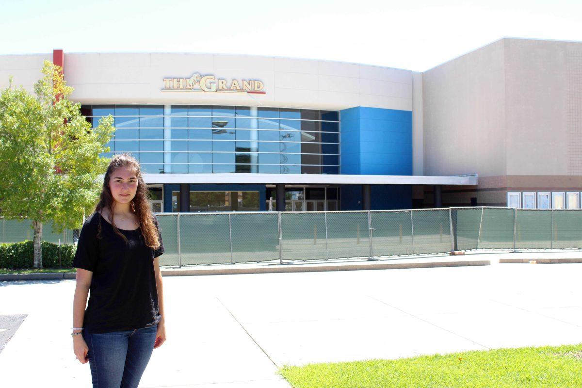 Heather Hamilton stands outside the still-closed Grand 16 where John Russell Houser opened fire July 23 during a movie she was watching.&#160;