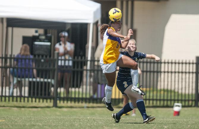 LSU freshman forward Alex Thomas (9) heads the ball during the Tigers' 5-1 victory against Marquette on Sunday, Sept. 20, 2015 in the LSU Soccer Stadium.