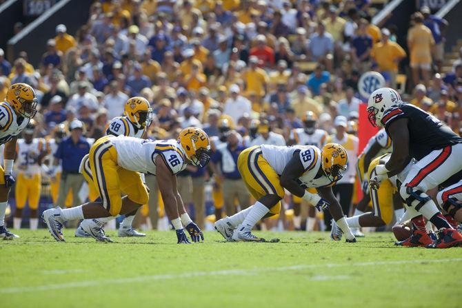 LSU junior defensive end Tashawn Bower (46) and LSU sophomore defensive tackle Greg Gilmore (99) get ready on the line of scrimmage at the football game on Saturday Sept. 19, 2015, in Tiger Stadium.