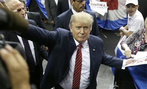 Republican presidential candidate Donald Trump waves to supporters after speaking at a campaign event in Dallas, Monday, Sept. 14, 2015. (AP Photo/LM Otero)