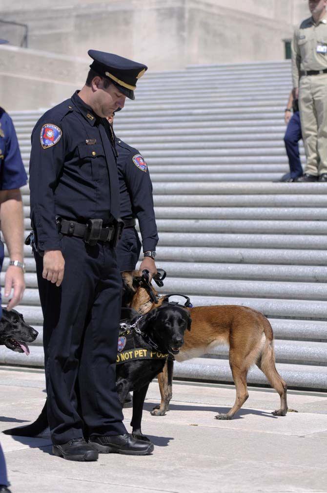 Louisiana Deputy canine handler Garrett Reeves attends the prayer rally to show his support to his fallen comrades around the state on Monday Sept. 14, 2015, at the Louisiana State Capitol.