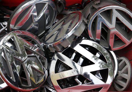 Volkswagen ornaments sit in a box in a scrap yard in Berlin, Germany, Wednesday, Sept. 23, 2015. The revelation that Volkswagen rigged diesel-powered cars to emit lower emissions during EPA tests is particularly stunning since Volkswagen has long projected a quirky brand image with an emphasis on being environmentally friendly _ an image that now appears in tatters. (AP Photo/Michael Sohn)