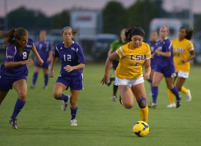 LSU sophomore forward Jorian Baucom (5) advances the ball down the field on Tuesday, Aug. 25, 2015, during the Tigers' 1-1 tie against Northwestern State at LSU Soccer Stadium.