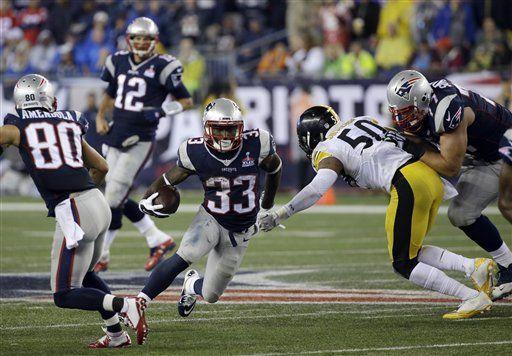 New England Patriots running back Dion Lewis (33) runs past Pittsburgh Steelers linebacker Ryan Shazier (50) in the second half of an NFL football game, Thursday, Sept. 10, 2015, in Foxborough, Mass. (AP Photo/Stephan Savoia)