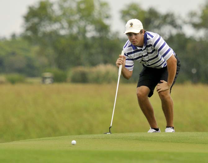 Freshman Eric Ricard eyes the course Saturday, October 5, 2013 at the fifth-annual David Toms Intercollegiate at the University Club.