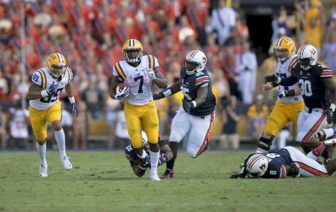 LSU sophomore running back Leonard Fournette (7) carries the ball down the field during the Tigers' 45-21 victory against Auburn on Saturday, Sept.19, 2015, in Tiger Stadium.