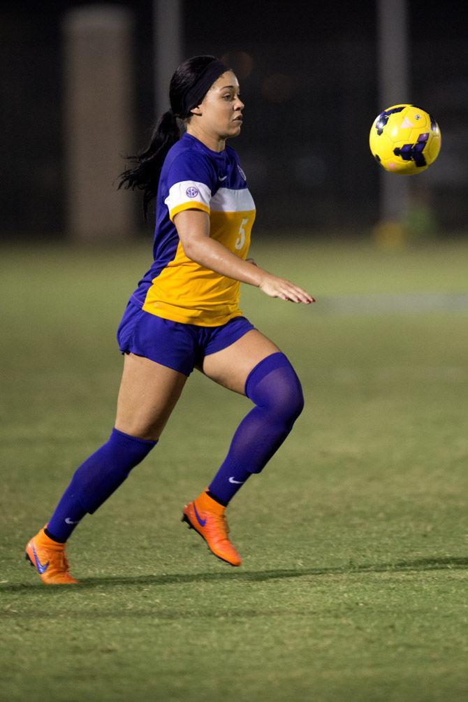 LSU sophomore Jorian Baucom (5) plays the ball in the air Friday, Sept. 5, 2015, during the Tigers' 1-1 tie against Ball State at LSU Soccer Stadium.