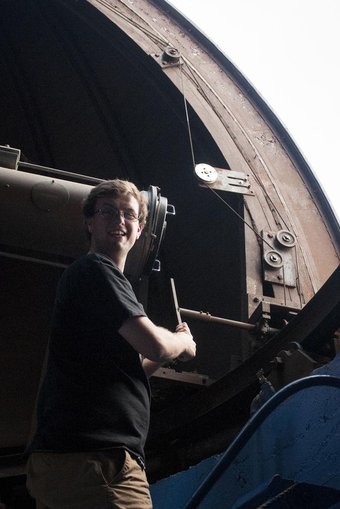 LSU physics graduate student Zach Edwards adjusts the telescope in the Landolt Astronomical Observatory in Nicholson Hall. The campus rooftop observatory will host a viewing of the upcoming lunar eclipse on Sunday, Sept. 27, 2015 beginning at 8 p.m.