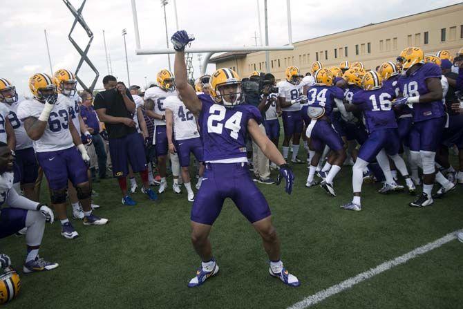 LSU sophomore defensive back Ed Paris (24) celebrates during the big cat drill in practice on Thursday, March 19, 2015 in Charls McClendon Practice Facility