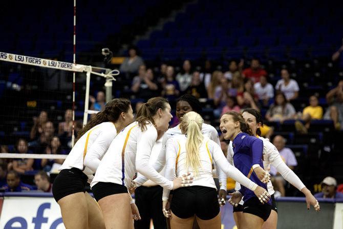 The LSU womens' volleyball team celebrates a goal Sunday, Sept. 27, 2015, during the Tigers' 3-0 victory over South Carolina in the PMAC.