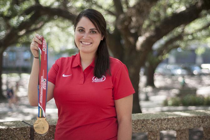 LSU political science major Caitlin Connor, 24, poses with her medals on Friday, Sept. 18, 2015, at the Memorial Oak Grove courtyard. Connor is the national champion in women's shooting.