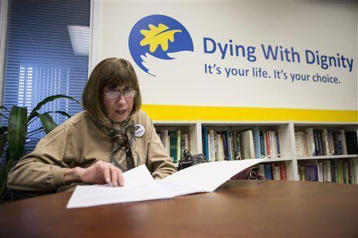 Linda Jarrett reads through notes at Dying with Dignity offices in Toronto, Friday, Feb. 6, 2015. Canada's highest court Friday, unanimously struck down a ban on doctor-assisted suicide for mentally competent patients with terminal illnesses. (AP Photo/The Canadian Press, Chris Young)