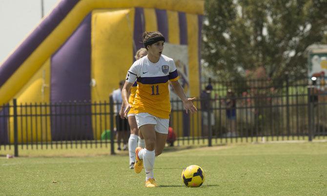 LSU senior midfielder Natalia Gomez-Junco (11) looks down the field for an open teammate on Sunday, Aug. 30, 2015, during the Tigers&#8217; 1-0 win against the Unversity of Minnesota at LSU Soccer Stadium.