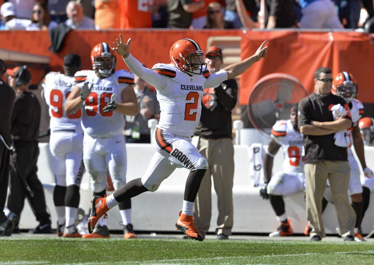 <p>Cleveland Browns quarterback Johnny Manziel (2) celebrates after throwing a 50-yard touchdown pass to Travis Benjamin in the second half of an NFL football game against the Tennessee Titans, Sunday, Sept. 20, 2015, in Cleveland. (AP Photo/Ron Schwane)</p>