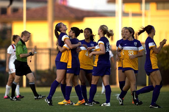 The LSU Womens' soccer team celebrates a goal Thursday, Sept. 17, 2015, during the Tigers' 4-3 victory over Georgia in the LSU Soccer Stadium.