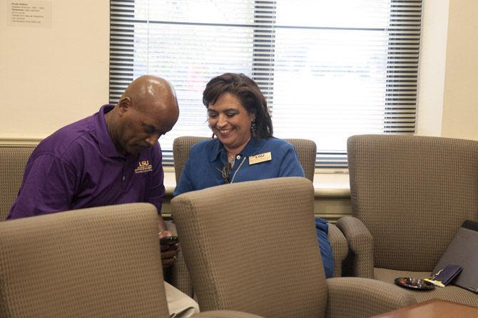 Campus Federal community affairs director Blaine Grimes and dean of students Mari Fuentes-Martin compare notes Thursday, Sept. 10, 2015, during the Open House event at the Office of Diversity.