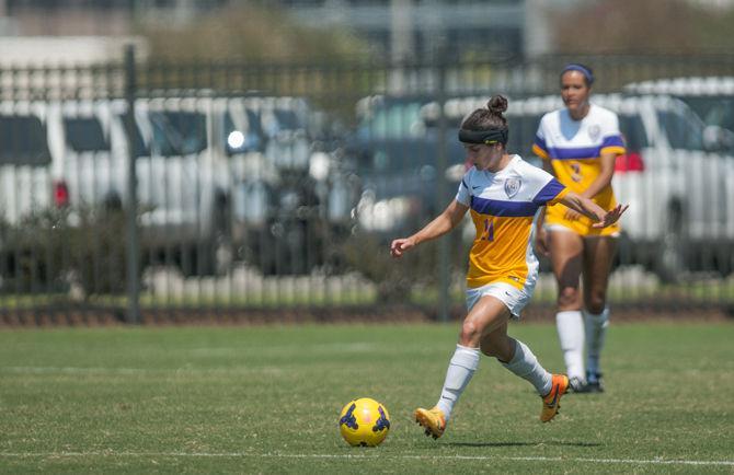 LSU senior midfielder Natalia Gomez-Junco crosses the ball during the Tigers' 5-1 victory against Marquette on Sunday, Sept. 20, 2015 in the LSU Soccer Stadium.