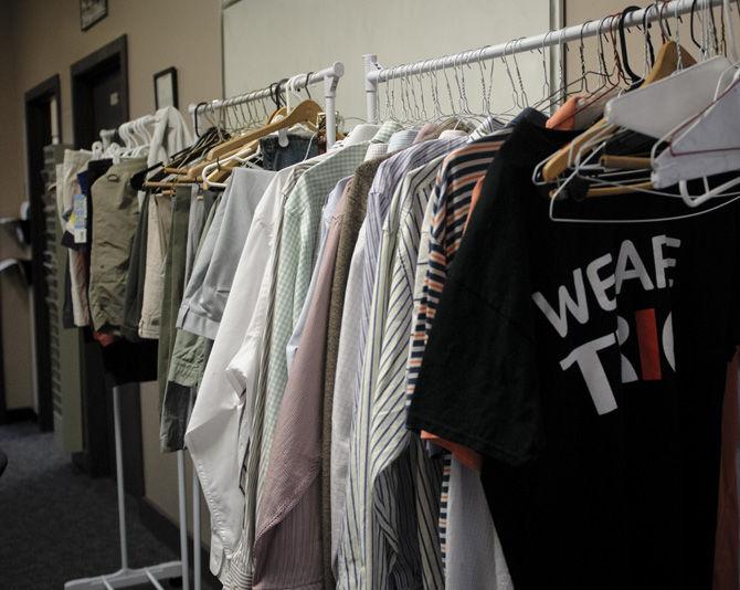 Several racks of clothes hang in an Allen Hall office on Thursday, Sept. 3, 2015, as these items are to be provided for first generation and low income students.