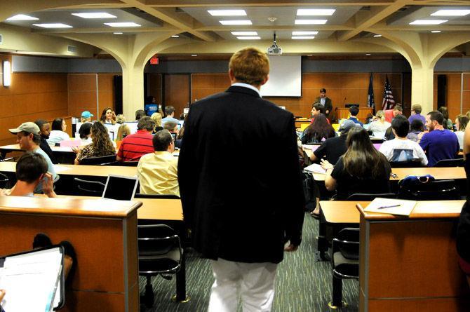 Speaker pro tempore Andrew Mullet walks down the aisle Wednesday, Aug. 26, during the Student Government meeting in the Student Union.