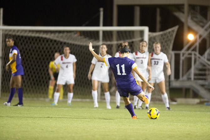 LSU senior midfielder Natalia Gomez-Junco (11) performs a free kick Thursday, Sept. 17, 2015, during the Tigers' 4-3 victory over Georgia in the LSU Soccer Stadium.