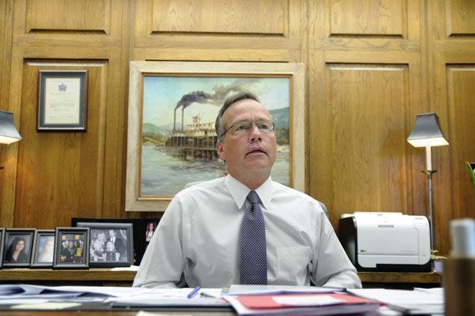 LSU President and Chancellor F. King Alexander speaks with writers from behind his desk on Thursday, Aug. 20, 2015, in the System Building.