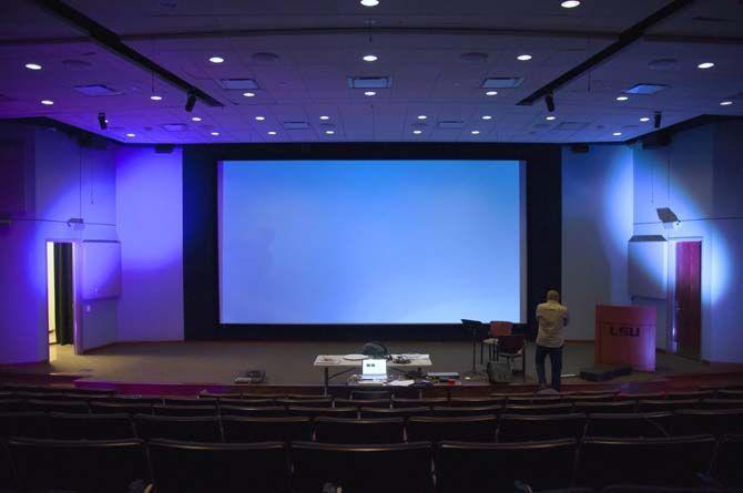 Assistant professor for eletronic music and digital art Jesse Allison begins to set up his faculty performance titled Digital Divide scheduled to show on Thursday on Monday Sept. 21, 2015, in the Digital Media Center Theatre on LSU campus.