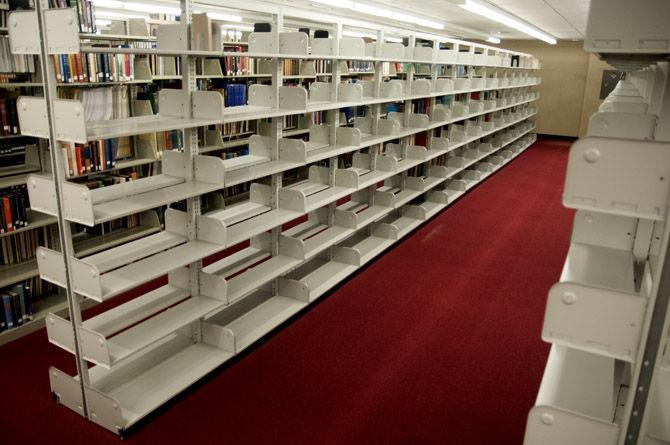 Shelves sit empty as books are moved Saturday, Sept. 12, 2015, on the third floor of Middleton Library.