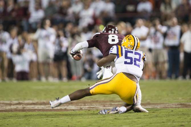 LSU Junior Linebacker, Kendell Beckwith (52), tackles Mississippi State Junior Wide Reciever, Fred Ross (8), during the Tigers 21-19 win over the Bulldogs on Saturday, at Davis Wade Stadium.