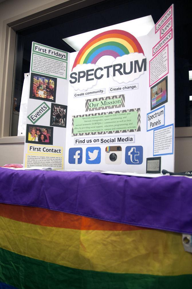 A Spectrum display provides information for LGBT supporters Tuesday, Sept. 22, 2015, during Rainbeaux Rush in the African American Cultural Center.