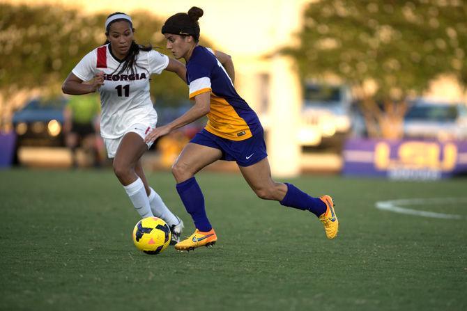 LSU senior midfielder Natalia Gomez-Junco (11) takes on Georgia sophomore defender Summer Burnett (11) Thursday, Sept. 17, 2015, during the Tigers' 4-3 victory over Georgia in the LSU Soccer Stadium.