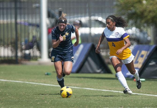 LSU junior forward Summer Clarke (4) dribbles the ball during the Tigers' 5-1 victory against Marquette on Sunday, Sept. 20, 2015 in the LSU Soccer Stadium.