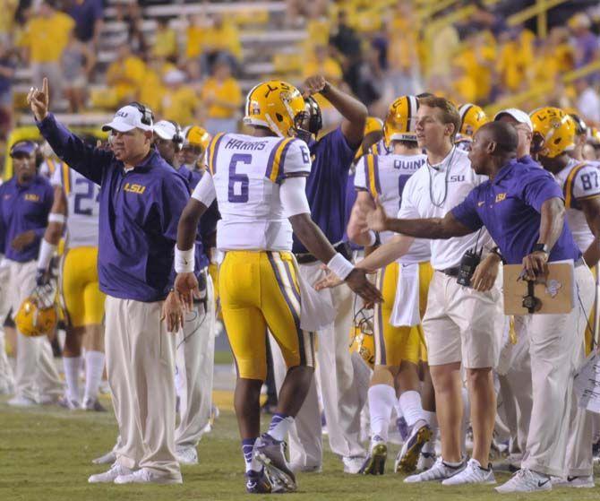 LSU freshman quarterback Brandon Harris (6) receives high fives from coaches during the Mississippi State game Saturday September 20, 2014 where LSU lost 34-29 in Tiger Stadium.