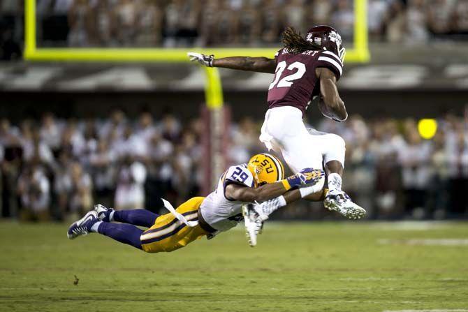 LSU Junior Safety, Rickey Jefferson (29), tackles Mississippi State Junior Running Back, Ashton Shumpert (32), during the Tigers 21-19 win over the Bulldogs on Saturday, at Davis Wade Stadium.