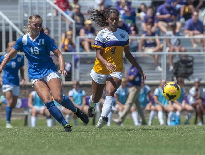 LSU junior foward Summer Clarke (4) races against Duke University&#8217;s sophomore defender/forward Schuyler DeBree (19) during the Tigers&#8217; 1-0 victory on Sunday, September 13, 2015 in LSU&#8217;s Soccer Stadium.