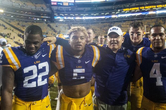 LSU head coach Les Miles sings LSU&#8217;s alma mater with his players after the Tigers&#8217; 48- 20 victory against Western Kentucky on Saturday, Oct. 24, 2015 in Tiger Stadium.