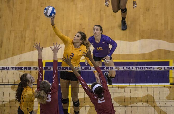 LSU senior middle blocker Emily Ehrle (2) hits the ball during the Tigers' 3-2 defeat against Arkansas on Wednesday, Sat. 23, 2015 in the Pete Maravich Assembly Center.