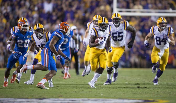 LSU sophomore running back Leonard Fournette (7) rushes the ball down the field on Saturday, Oct. 17, 2015, during the Tigers' 35-28 victory against Florida in Tiger Stadium.