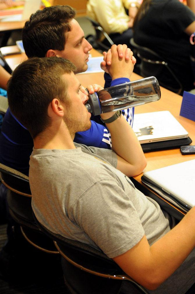 Senator Zach Ingram hydrates himself Wednesday, Aug. 26, during the Student Government meeting in the Student Union.