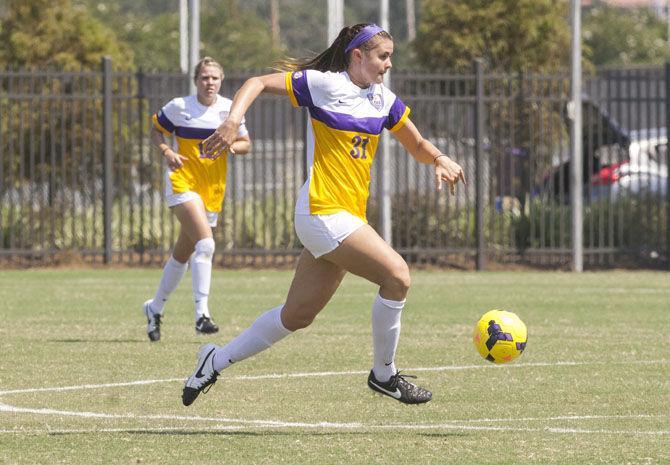 LSU sophomore forward Debbie Hahn (31) dribbles the ball on Sunday, Sept. 20, 2015 during the Tigers&#8217; 5-1 win against Marquette University at LSU Soccer Stadium.