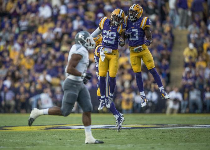 LSU junior safety Rickey Jefferson (29) and junior defensive back Dwayne Thomas (13) celebrate a defensive play during the Tigers&#8217; 44-22 victory against Eastern Michigan on Saturday, Oct. 03, 2015 in Tiger Stadium.