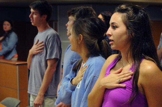 Senator Ginnie Bech recites the Pledge of Allegiance Wednesday, Aug. 26, during the Student Government meeting in the Student Union.