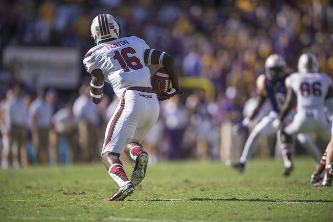 University of South Carolina freshman cornerback Rashad Fenton (16) runs in a touchdown during the Tigers' 45-24 victory against on Saturday, Oct. 10, 2015, in Tiger Stadium.