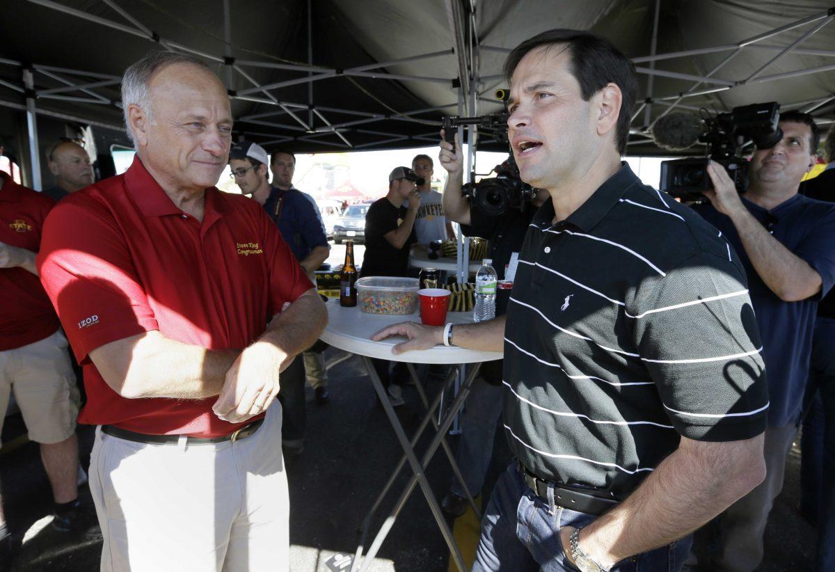 FILE - In this Sept. 12, 2015, file photo, Republican presidential candidate Sen. Marco Rubio, R-Fla., talks with Rep. Steve King, R-Iowa, left, during a tailgate party before an NCAA college football game between Iowa and Iowa State in Ames, Iowa. After a summer largely spent raising money for his Republican campaign for president, Rubio says he&#8217;s about to start spending a whole lot more time in Iowa and other early voting states. Rubio&#8217;s campaign says he will be back in Iowa next week, then in New Hampshire, Nevada and South Carolina. All four states are voting in the initial wave of caucuses and primaries. (AP Photo/Charlie Neibergall, File)