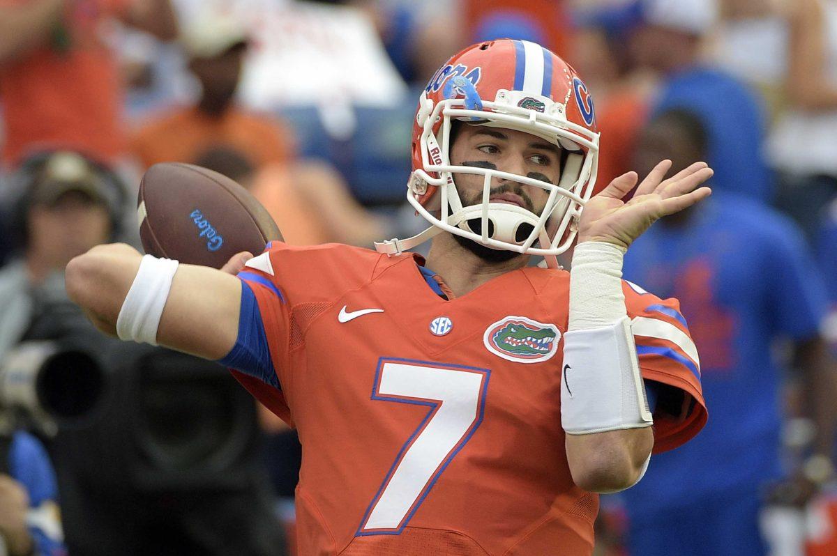 FILE - In this Oct. 3, 2015, file photo, Florida quarterback Will Grier warms up before an NCAA college football game against Mississippi in Gainesville, Fla. A person familiar with the situation says Grier has been suspended indefinitely for violating the NCAA's policy on banned drugs. The person spoke to The Associated Press on condition of anonymity because the school has not announced the decision. Grier is considering an appeal. (AP Photo/Phelan M. Ebenhack, File)