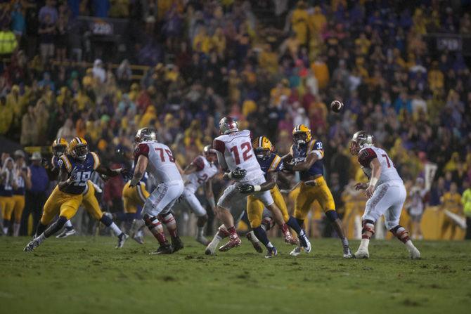 LSU senior linebacker Deion Jones (45) tackles Western Kentucky University senior quarterback Brandon Doughty (12) during the Tigers&#8217; 48- 20 victory against the Hilltops on Saturday, Oct. 24, 2015 in Tiger Stadium.