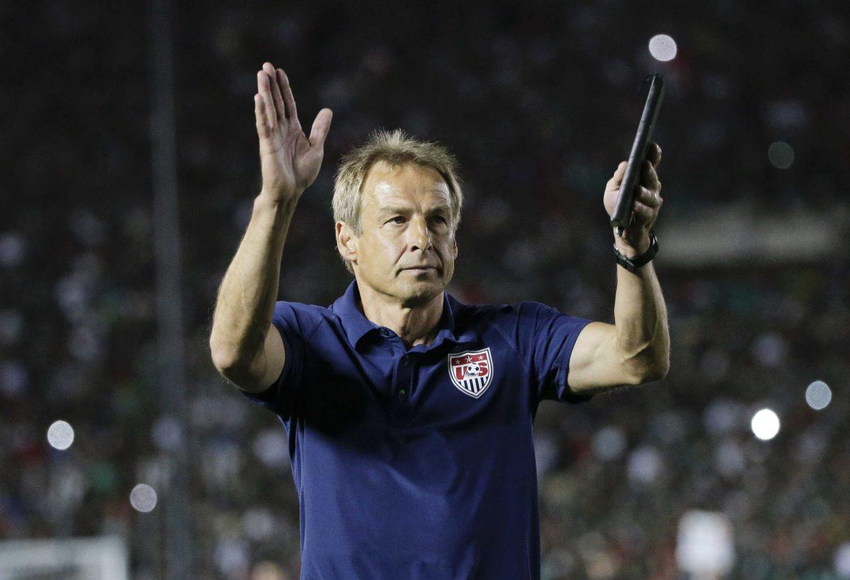 United States coach Jurgen Klinsmann acknowledges the fans after his team lost 2-3 to Mexico during the CONCACAF Cup playoff soccer match at the Rose Bowl Stadium, in Pasadena , Calif. Saturday, Oct. 10, 2015, (AP Photo/Jae C. Hong)