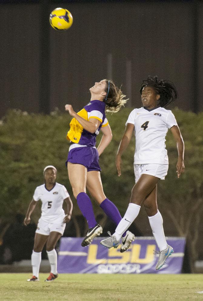 LSU senior midfielder Heather Magee (12) goes up for a header against the University of Missouri&#8217;s junior defender/midfielder Erin Webb (4) on Friday, Oct. 9, 2015 during the Tigers&#8217; 2-1 win against Mizzou at the LSU Soccer Stadium.